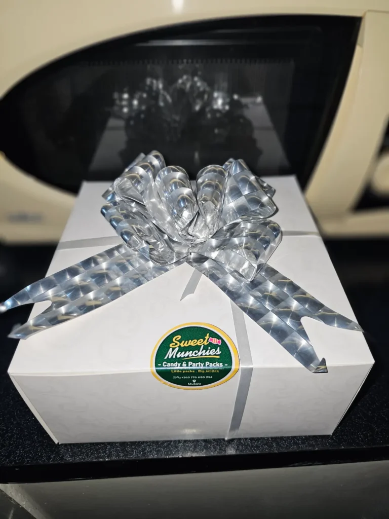 Snack boxes Mutare — white Sweet Munchies gift box tied with a silver ribbon bow